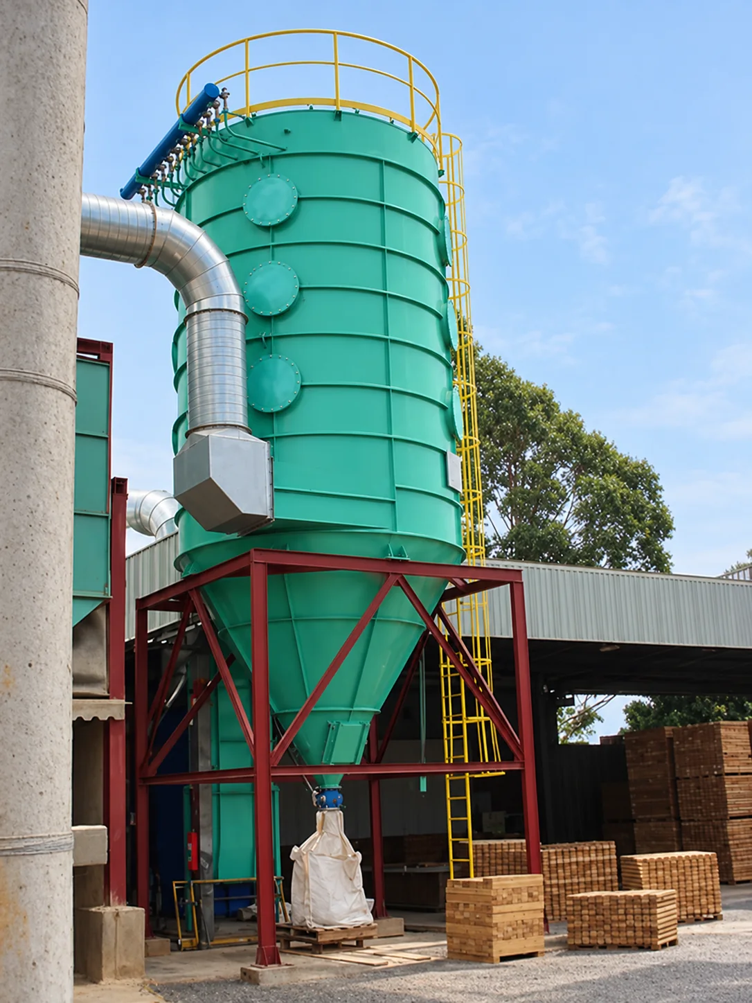 Green CicloFlux filter installed on a red steel structure, with inlet duct, ladder, and yellow guardrails