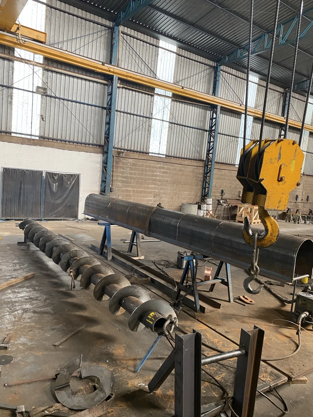 Long screw flight and casing being manufactured in the workshop